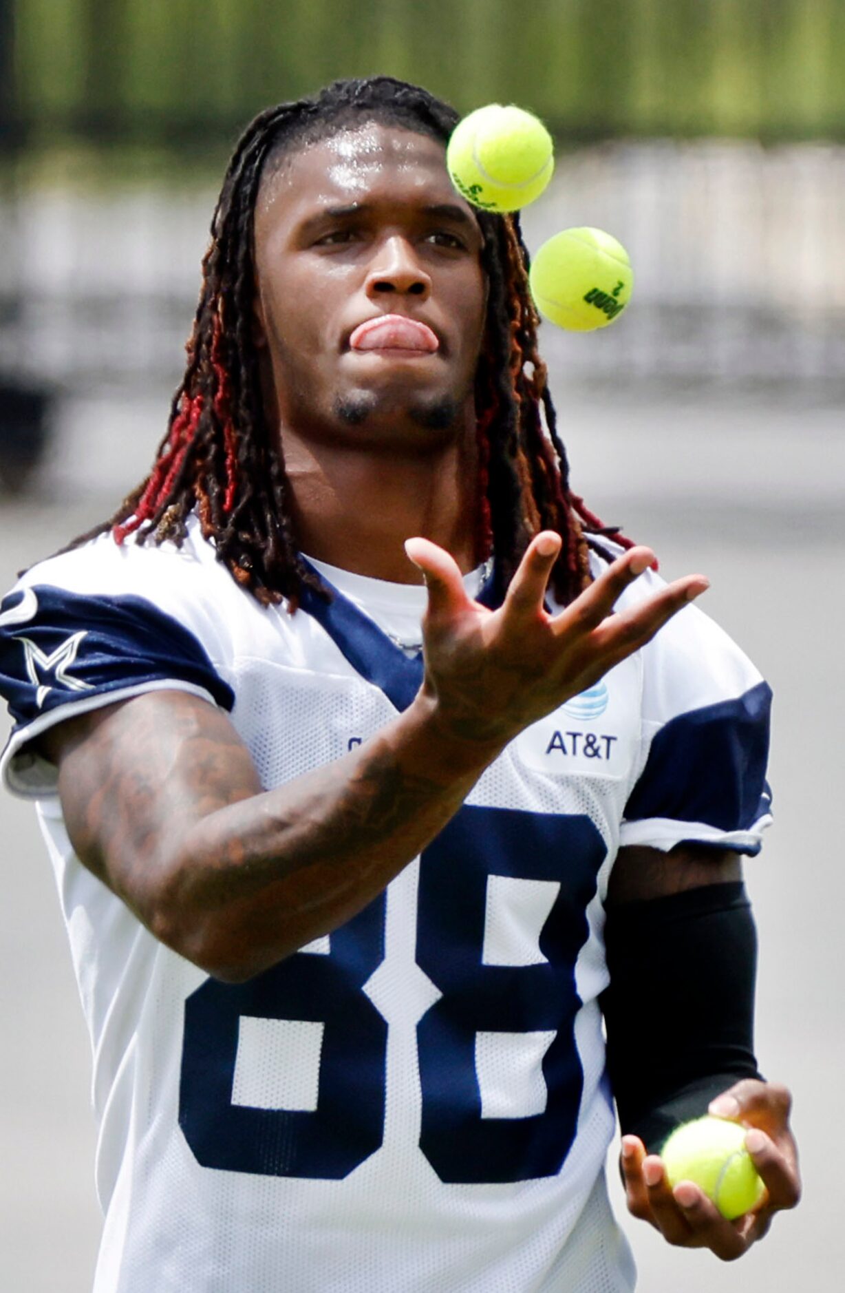 Dallas Cowboys wide receiver CeeDee Lamb (88) works on his ball juggling skills during...