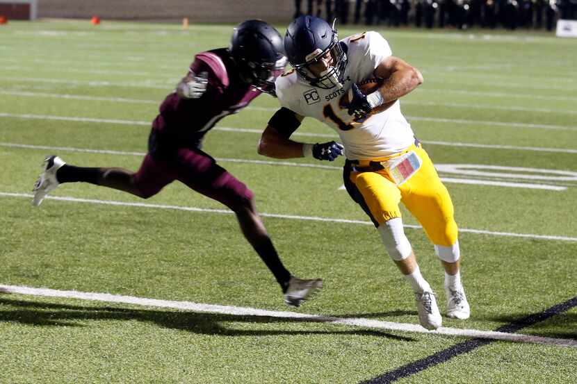 Highland Park wide receiver Scully Jenevein (#13) scores a touchdown in front of Mansfield...