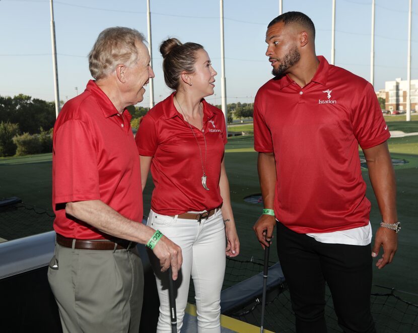 Richard Collins, left, Genevieve Collins, and Dak Prescott talk during the Tackle Tomorrow...