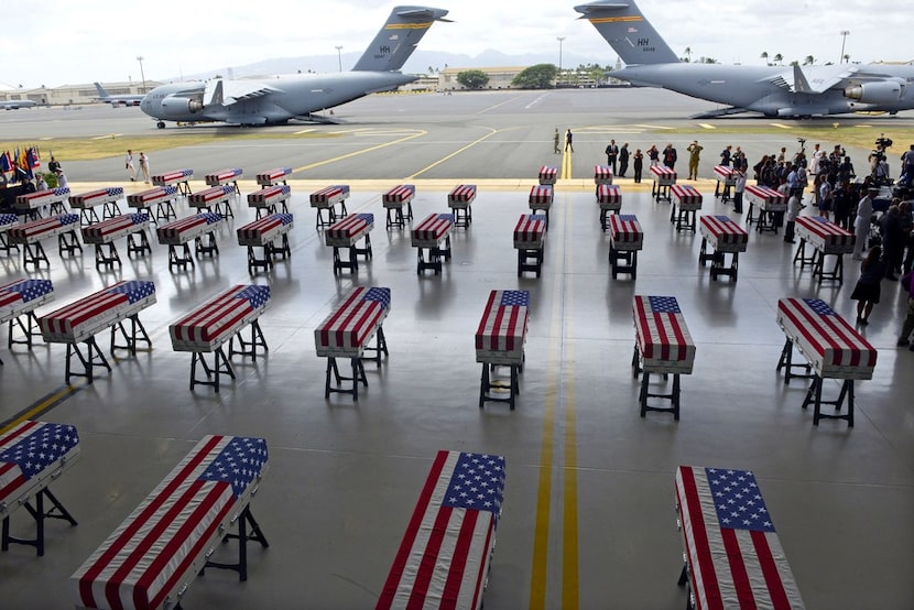 The remains of American soldiers repatriated from North Korea are lined up during a...