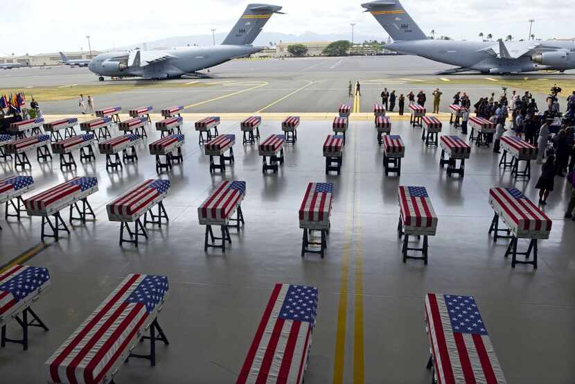 The remains of American soldiers repatriated from North Korea are lined up during a...