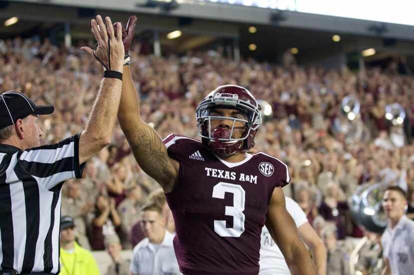 Texas A&M's Christian Kirk (3) celebrates a touchdown against New Mexico State during the...