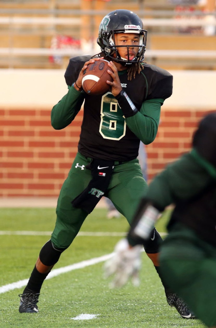 Lake Ridge quarterback Jett Duffey looks to pass against Waco in a high school football game...