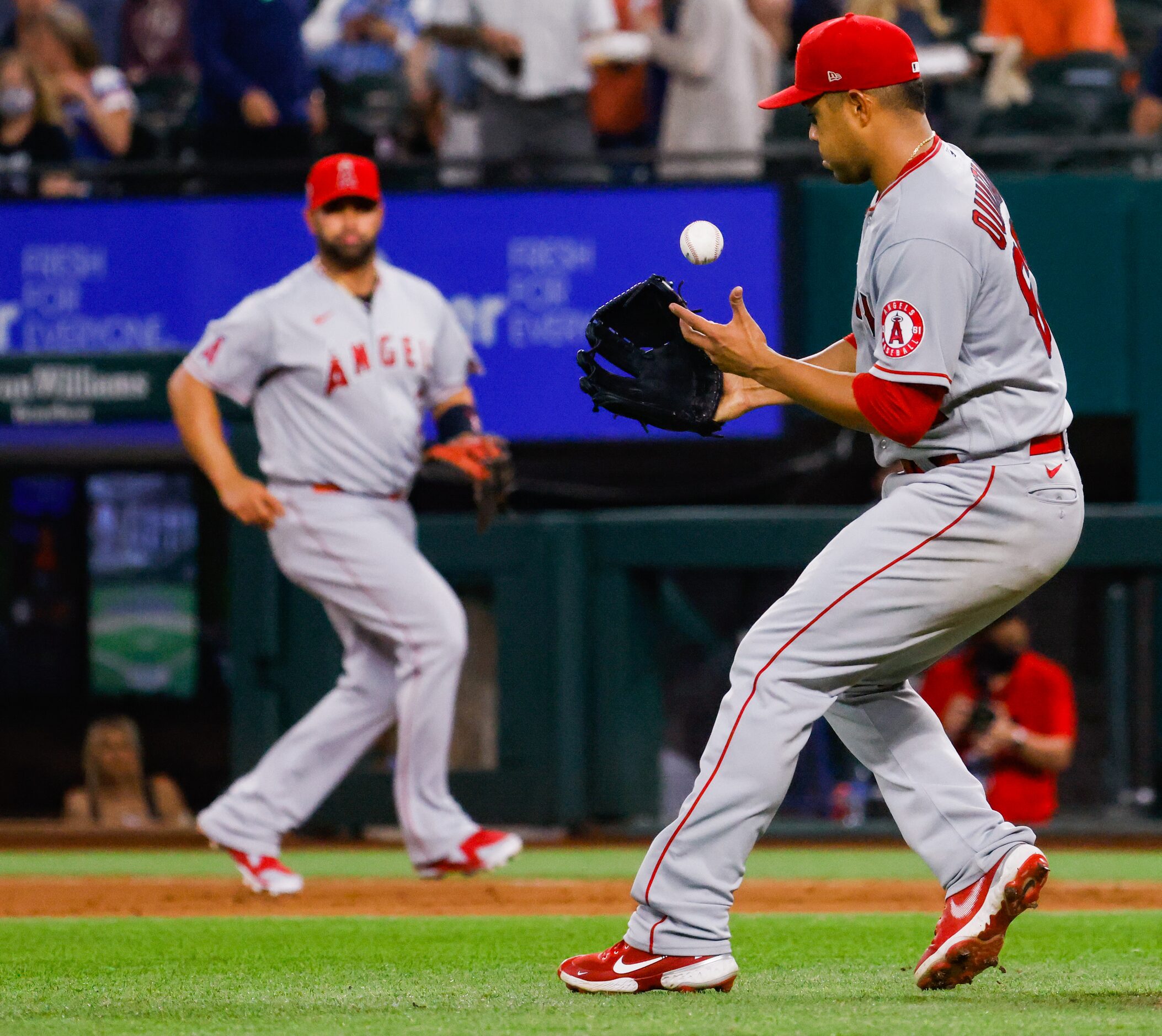 Los Angeles Angels starting pitcher Jose Quintana (62) prepares to throw Texas Rangers third...