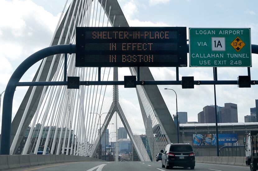 An electronic highway message board n on I-93 near the Zakim Bridge in Boston warns people...