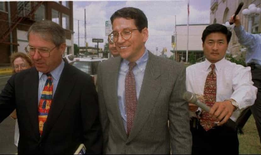 Former council member Paul Fielding (center) walked out of federal court with his attorney...