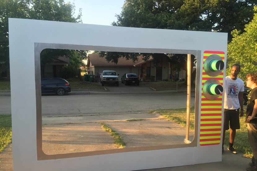 With the help of local artists, the band built a large television set in its driveway. 