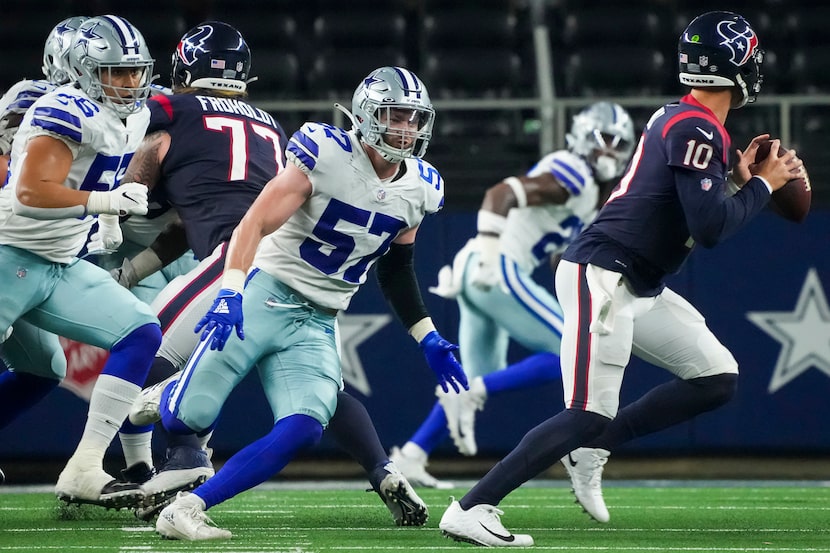 Dallas Cowboys linebacker Luke Gifford (57) chases Houston Texans quarterback Davis Mills...