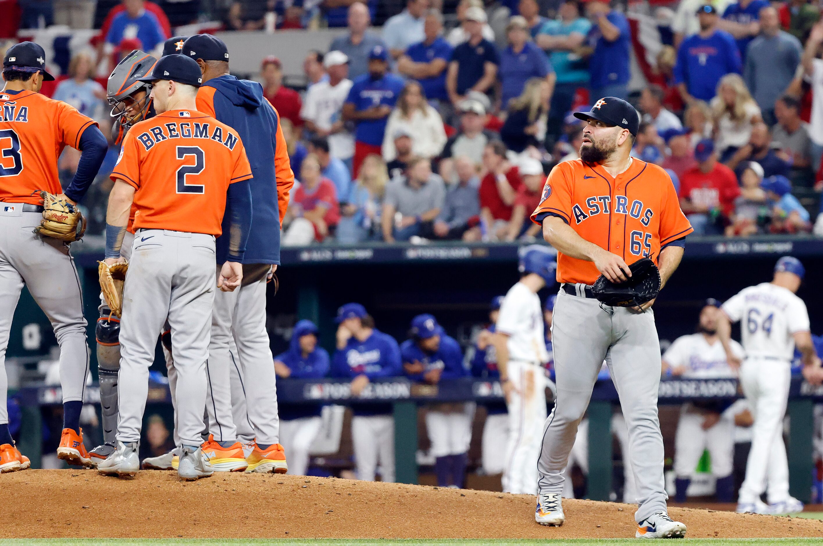 Houston Astros starting pitcher Jose Urquidy (65) walks to the dugout after being pulled by...