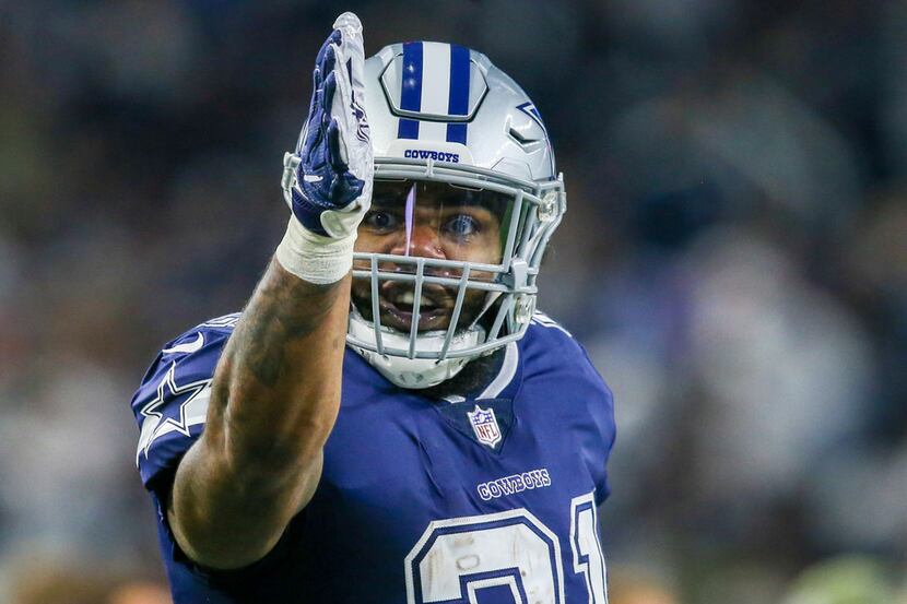 Dallas Cowboys running back Ezekiel Elliott (21) motions a first down during an NFL game...