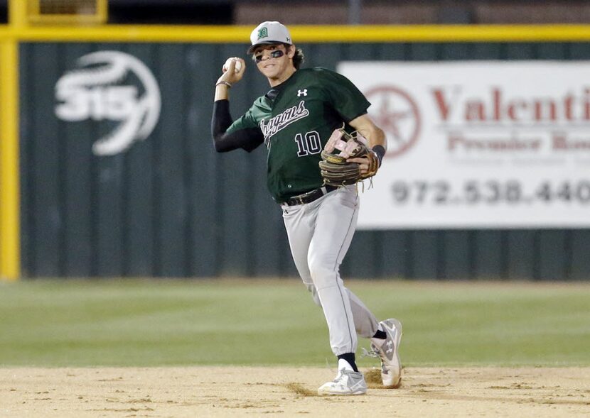 Southlake Carroll's Hudson Sanchez (10) throws to first to force out Coppell's Jacob Nesbit...