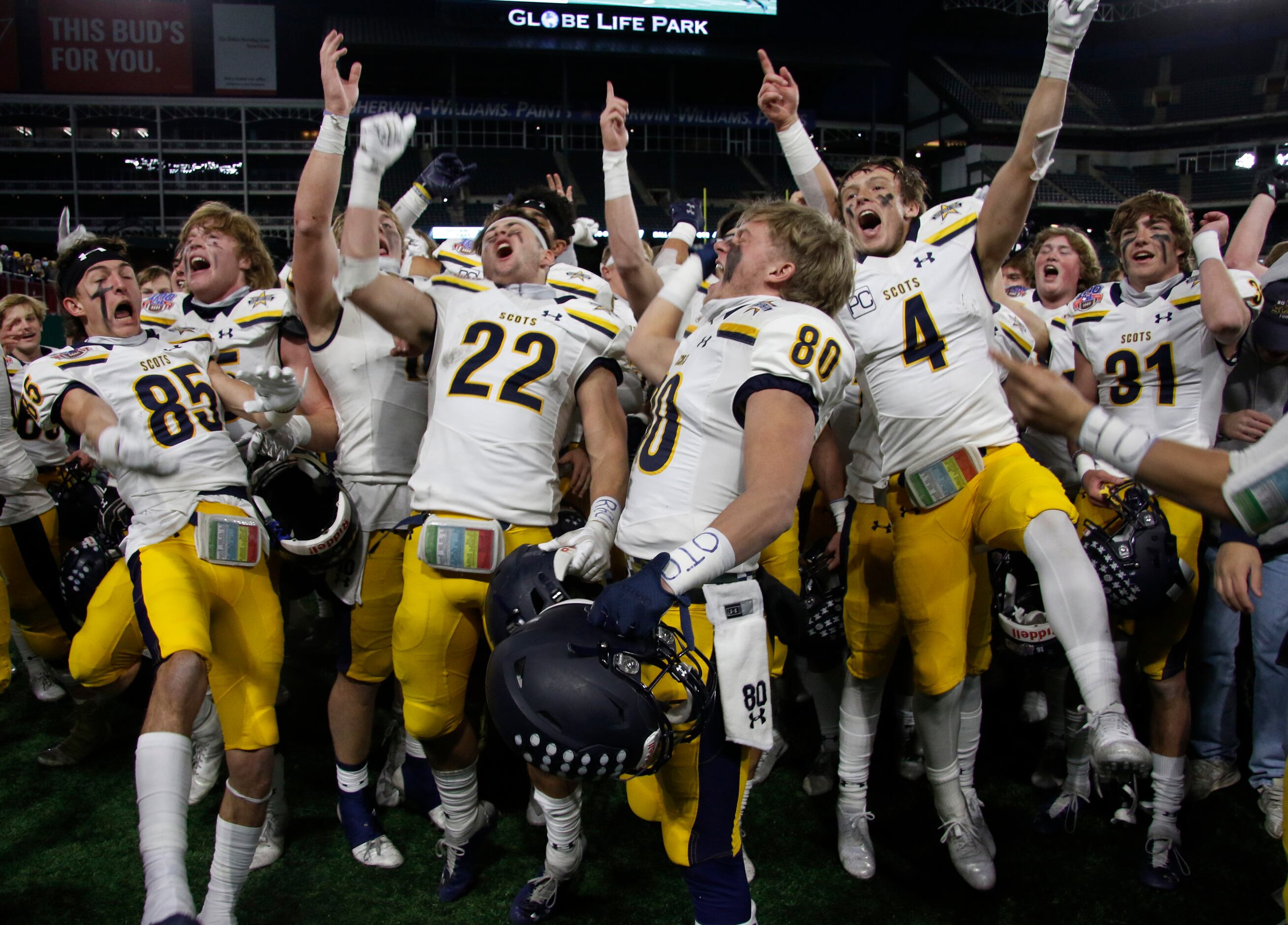 Highland Park Scots players celebrate with great intensity following their 30-20 victory...