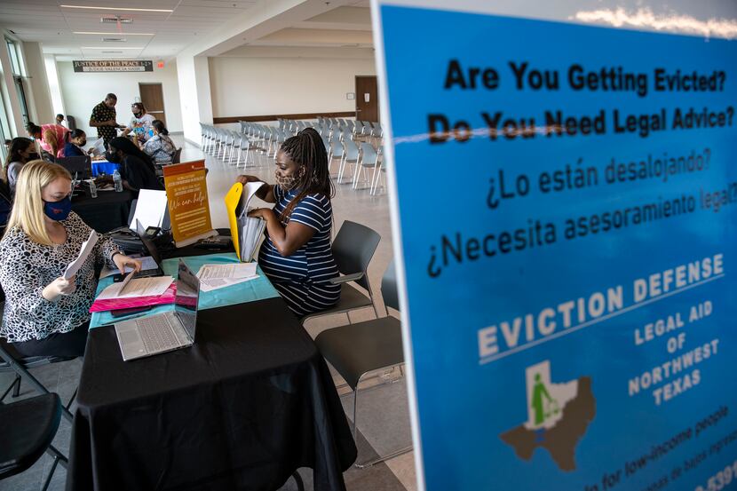 Kelsey Vanderbilt (left) a staff attorney with CitySquare, provides eviction case resources...