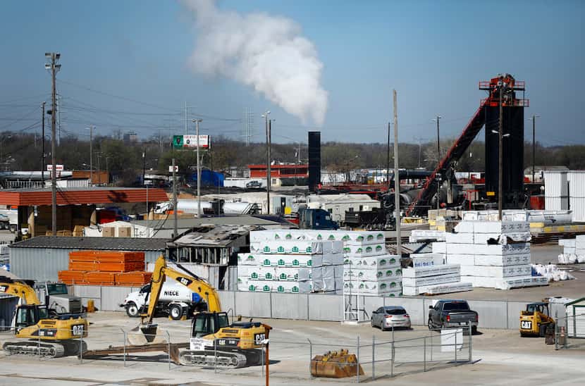 Austin Industries' asphalt plant (center at smokestack) operates on Union Pacific Railroad...