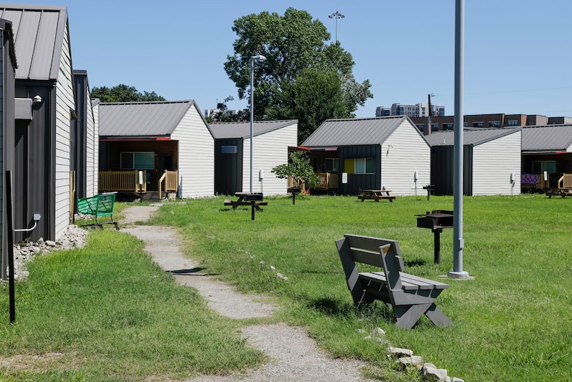 Several tiny homes are seen at The Cottages at Hickory Crossing, Thursday, June 6, 2024, in...