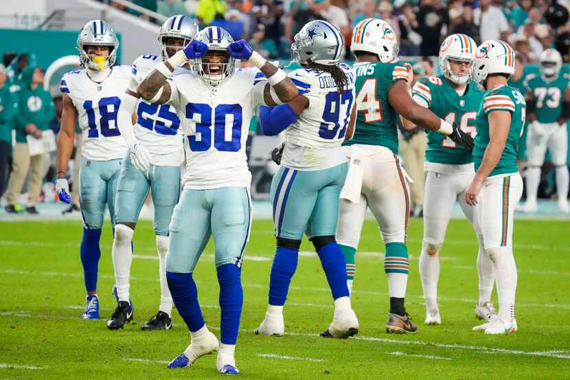 Dallas Cowboys safety Juanyeh Thomas (30) reacts after a field goal by Miami Dolphins place...