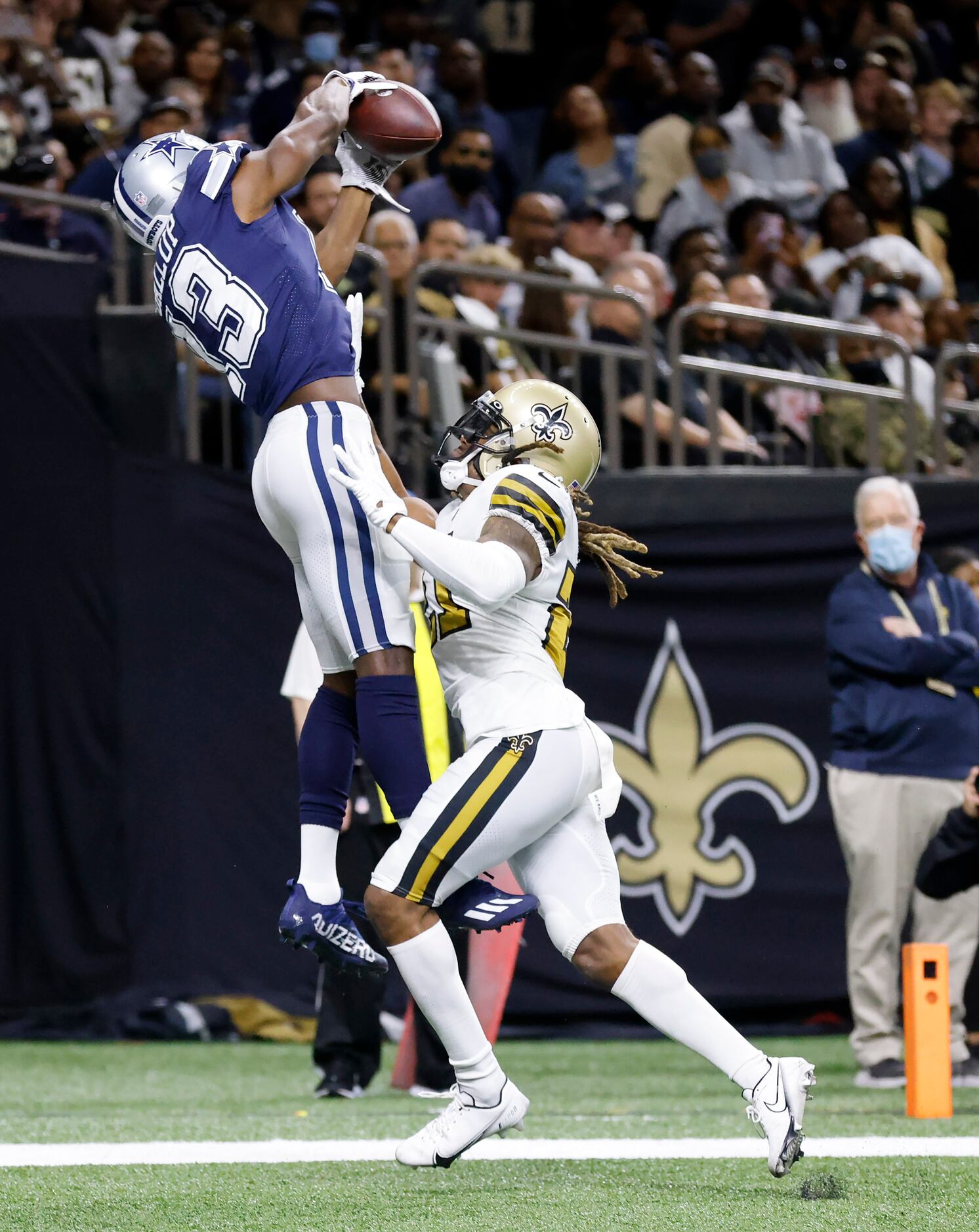 Dallas Cowboys wide receiver Michael Gallup (13) goes high for a first quarter touchdown...