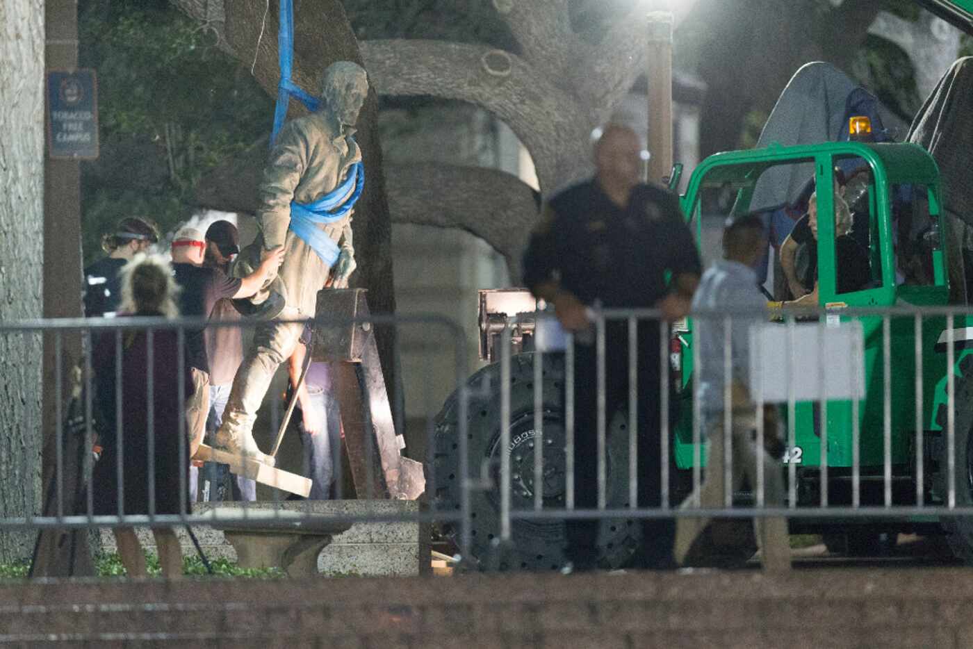Confederate General Robert E. Lee statue is removed from the south mall of the University of...