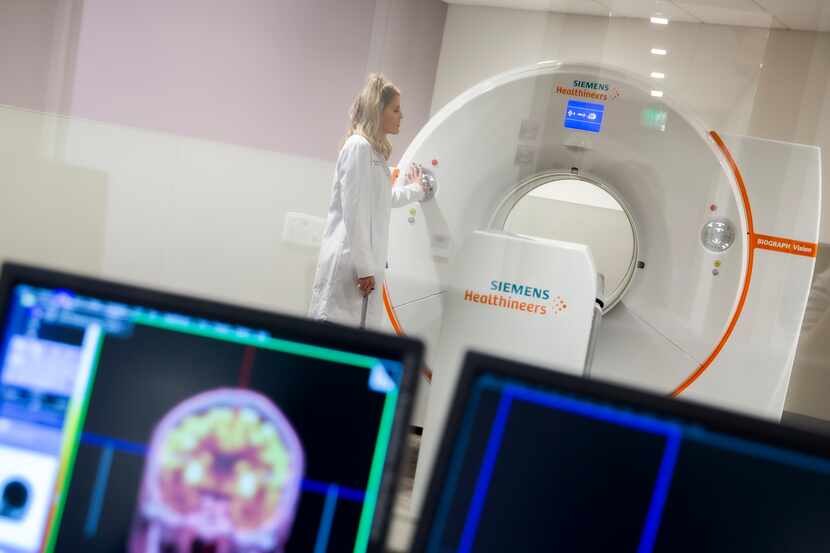A woman trains to use a CAT scan at the University of North Texas Health Science Center in...