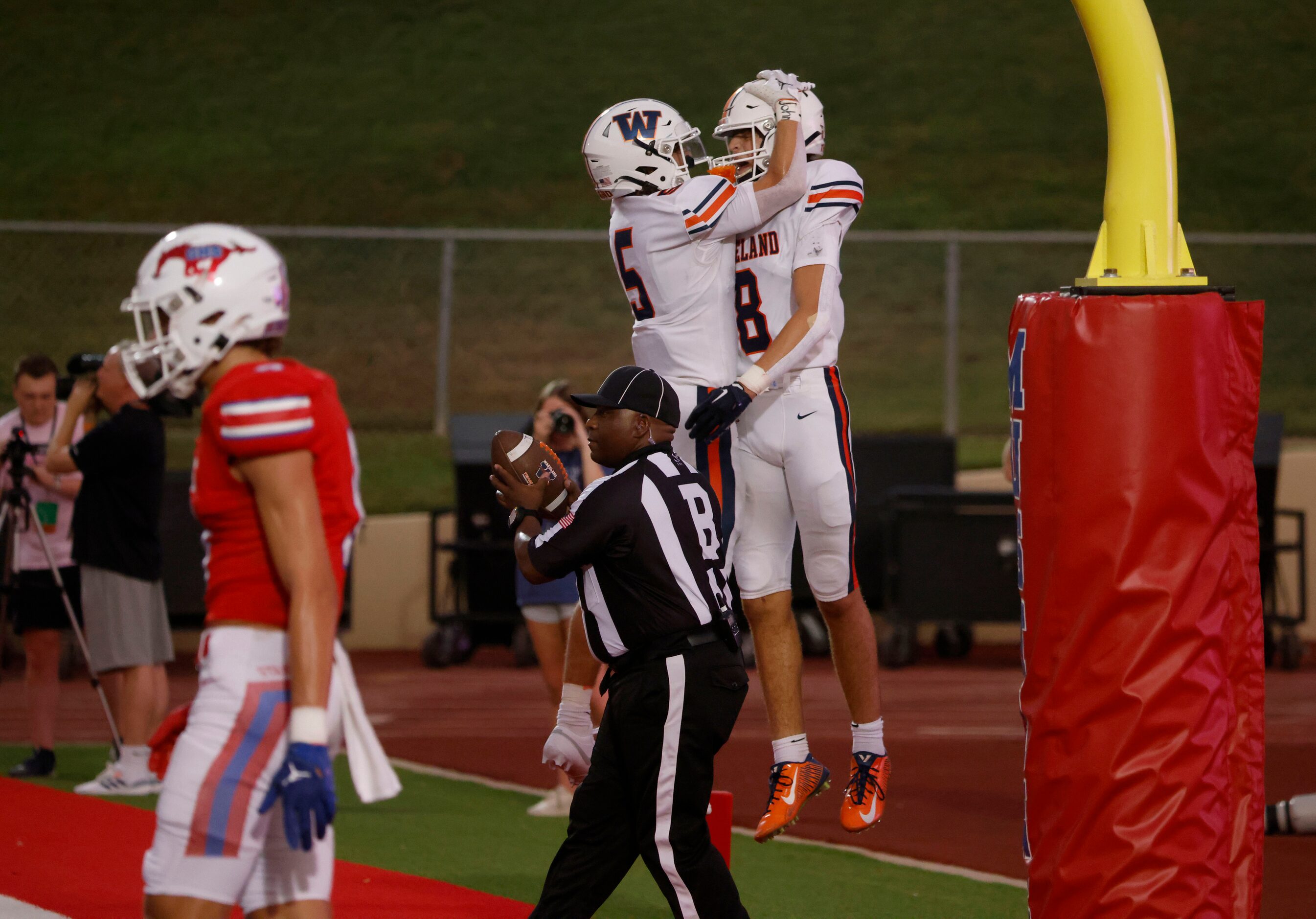 Frisco Wakeland’s Ashdyn Kahouch (5) celebrates with Ryan Treadway (8) after  Treadway’s...