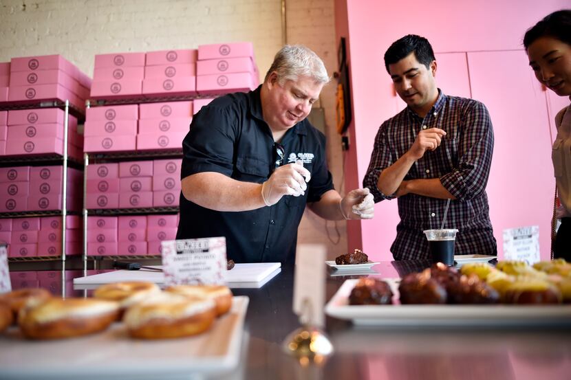 Owner Darren Cameron, left, closed Glazed Donut Works in 2018. He's back with pop-ups in...