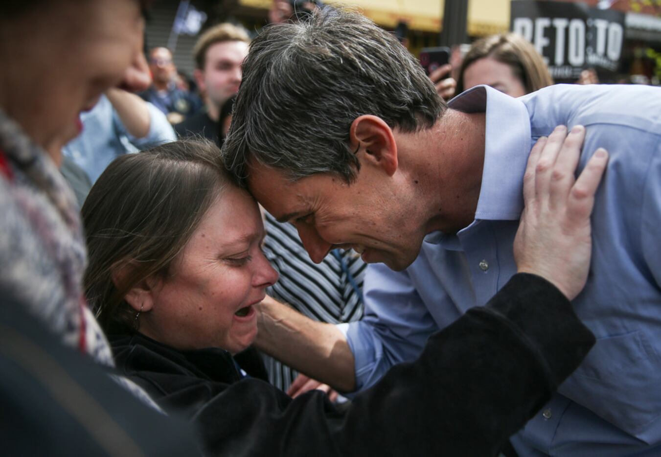 Beto O'Rourke embraces his sister, Erin O'Rourke, after speaking at a presidential campaign...