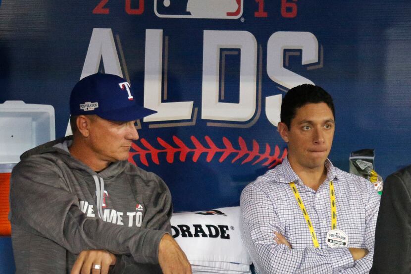 Texas Rangers manager Jeff Banister, left, and general manager Jon Daniels watch batting...