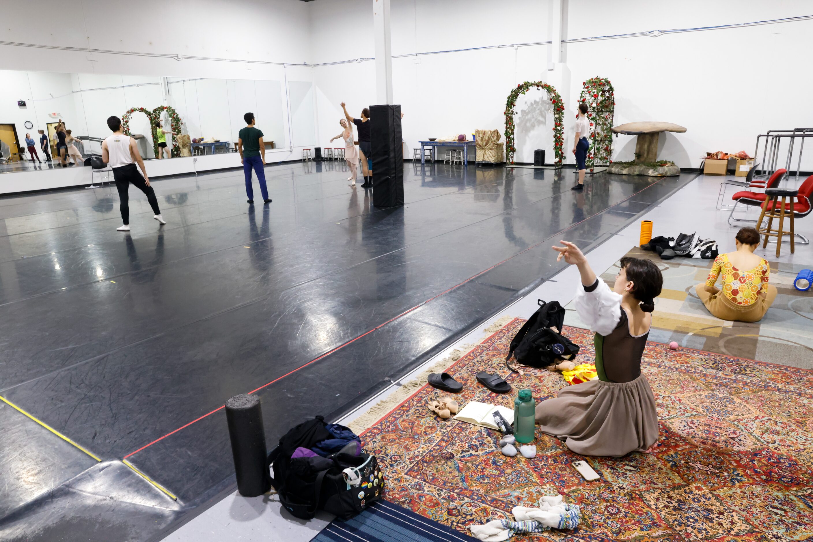 Alexandra F. Light (right) packs her belongings after a day of rehearsals for the Texas...