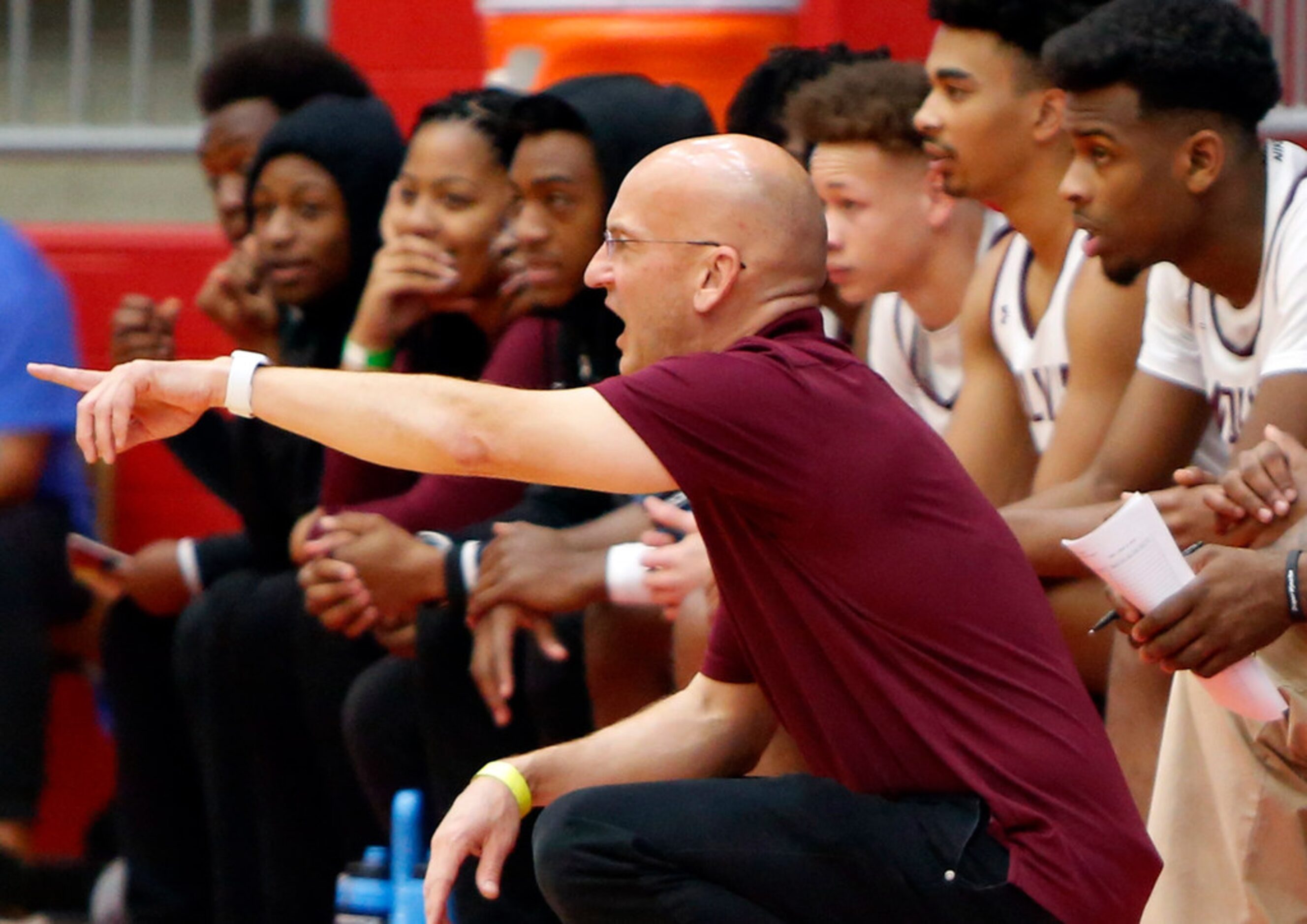 Mansfield Timberview head coach Duane Gregory directs his players during first half action...