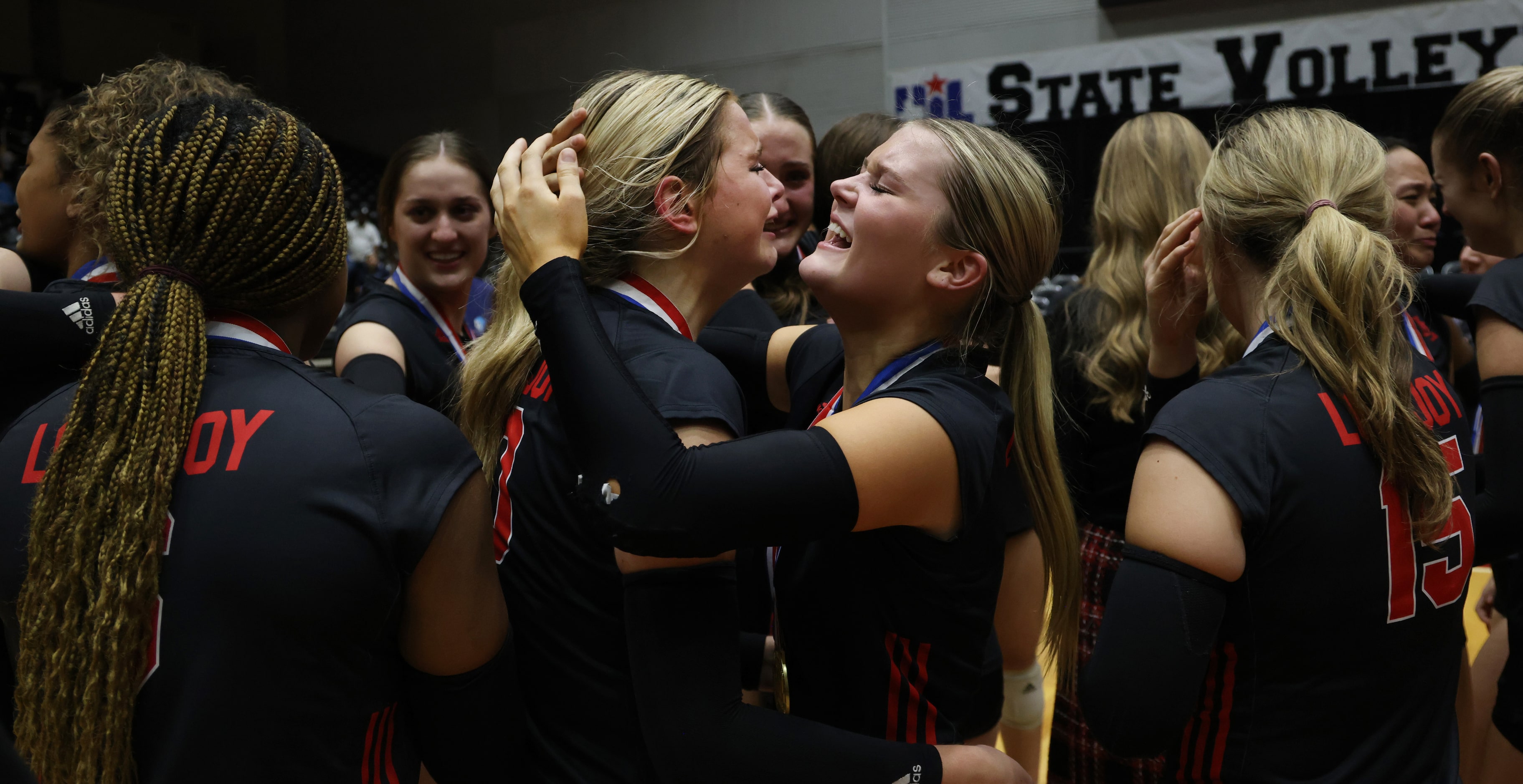 Lovejoy teammates Kalin Carson (9), center right, and Skylar Jackson (10), center left,...