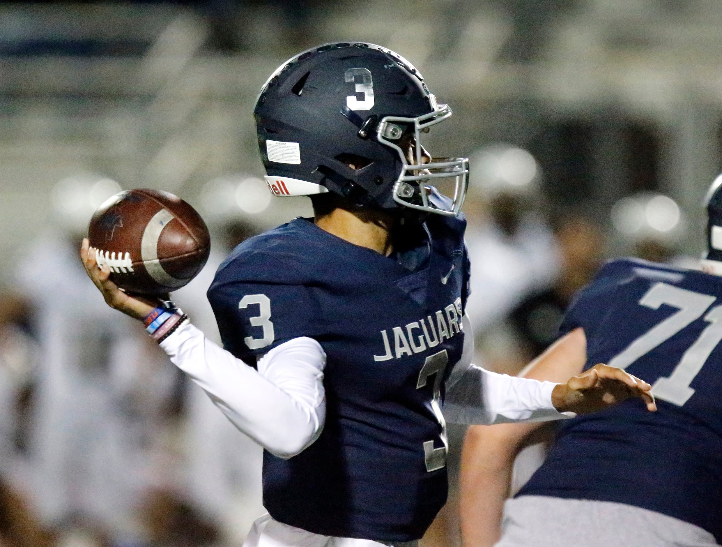 Flower Mound High School quarterback Nick Evers (3) tosses a pass during the first half as...