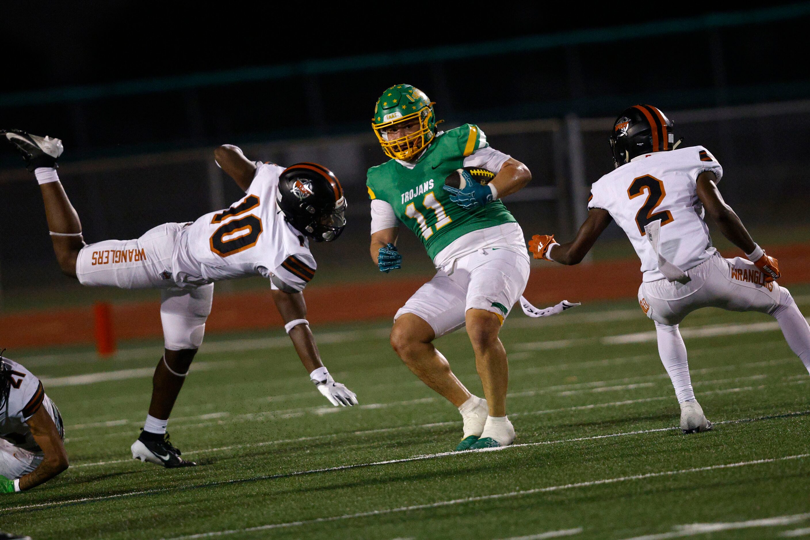 Newman Smith's Alex Segura (11) keeps the ball away from West Mesquite's Daedrion Holley...