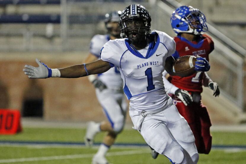 Plano West High School running back Sotonye Jamabo (1) puts an exclamation point on the...
