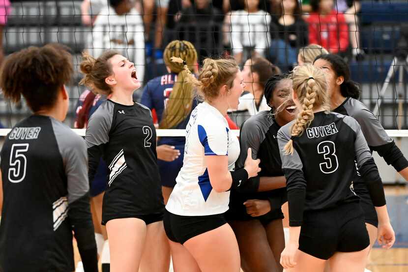 Denton Guyer players celebrate after a point during Tuesday's four-set win over Allen that...