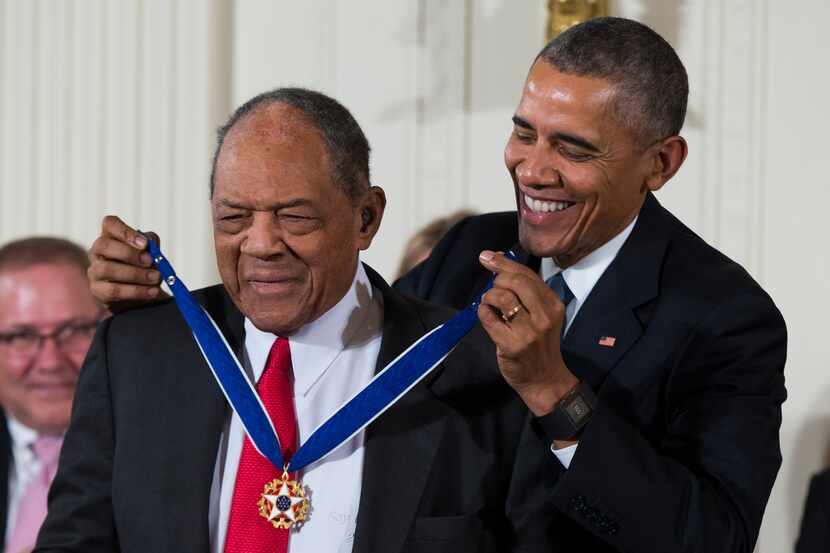 Baseball Hall of Famer Willie Mays (left) receives the Presidential Medal of Freedom from...