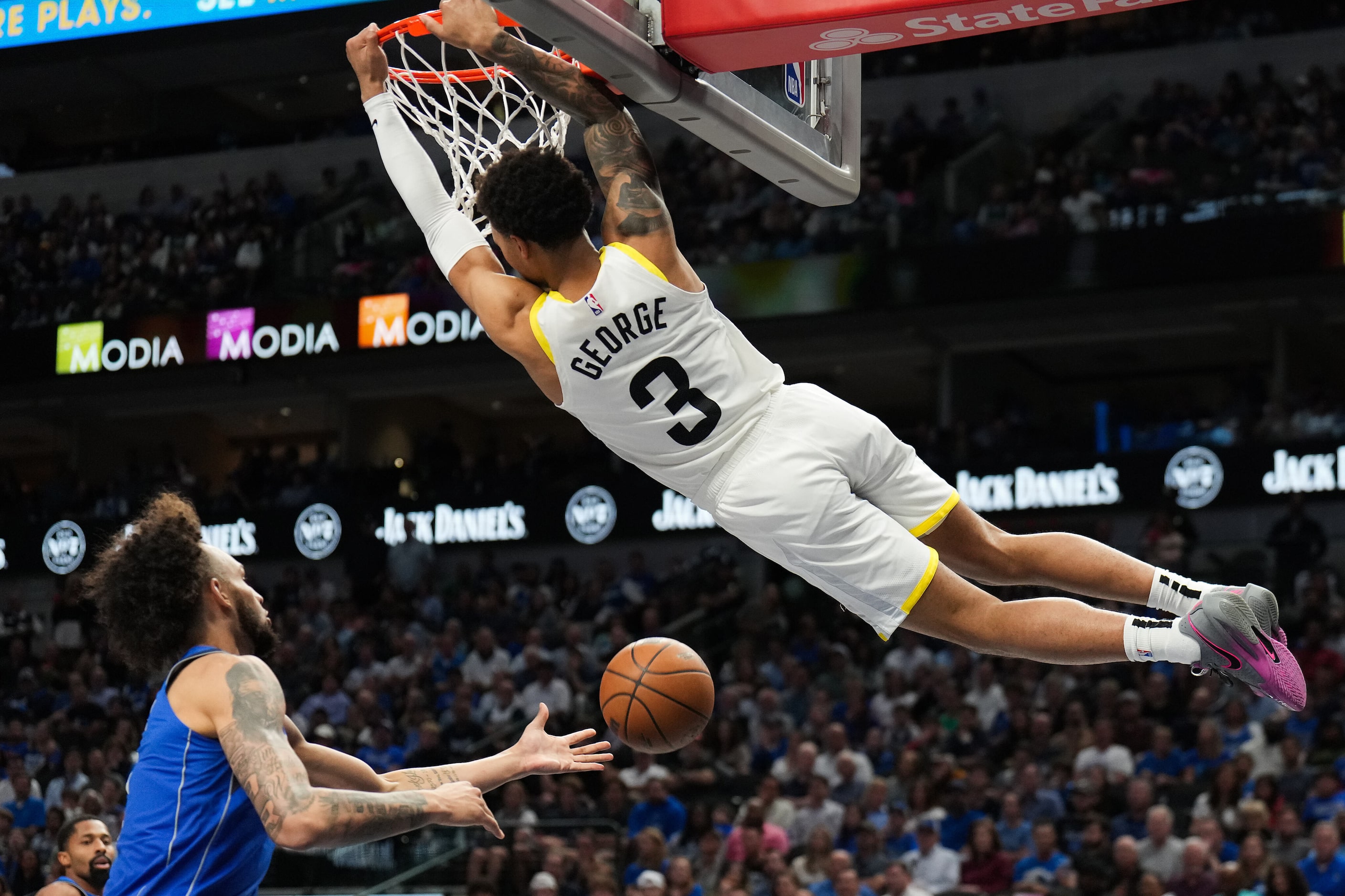 Utah Jazz guard Keyonte George (3) hands from the rim after a dunk past Dallas Mavericks...