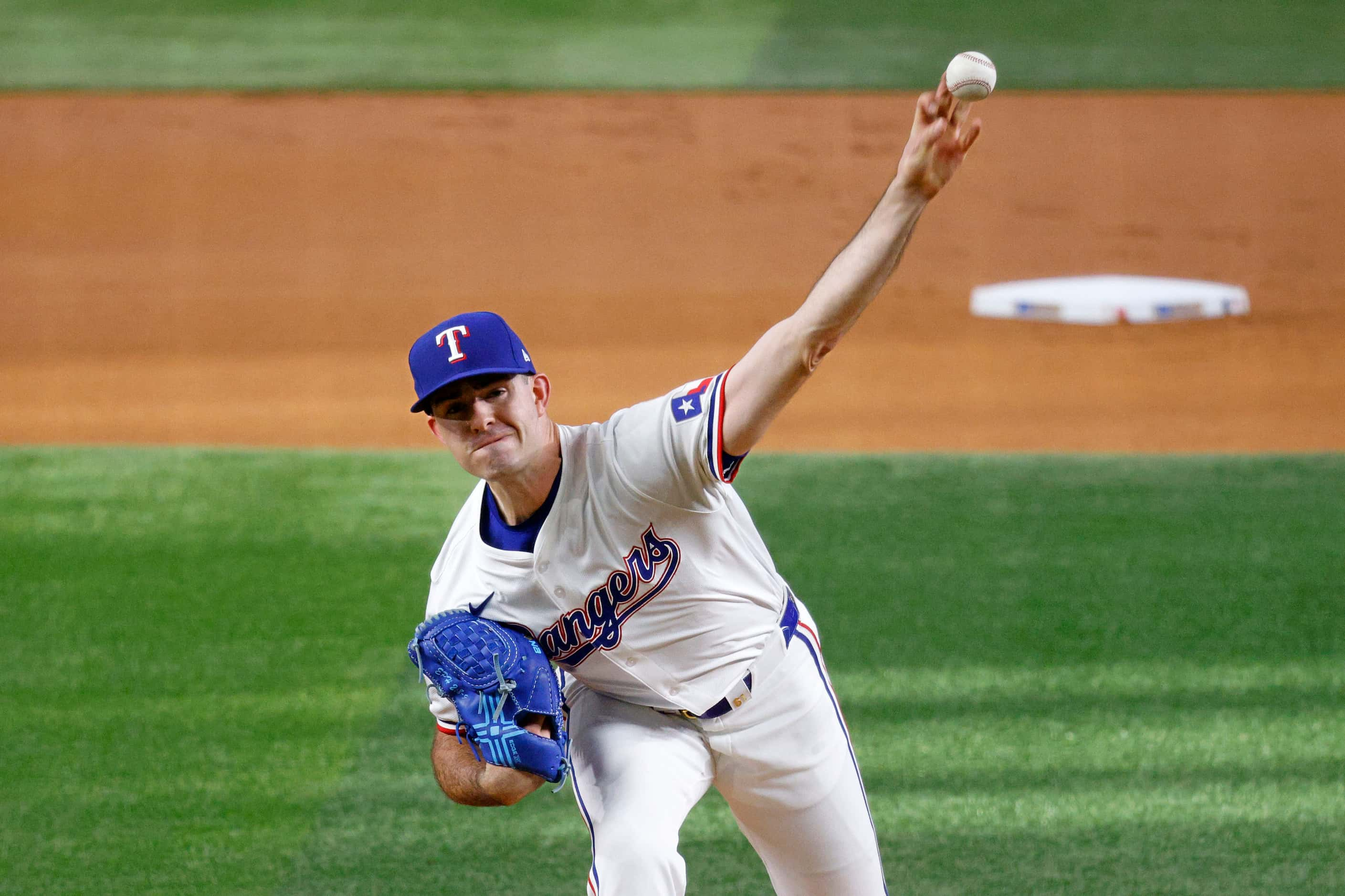 Texas Rangers pitcher Cody Bradford (61) delivers during the first inning of a baseball game...