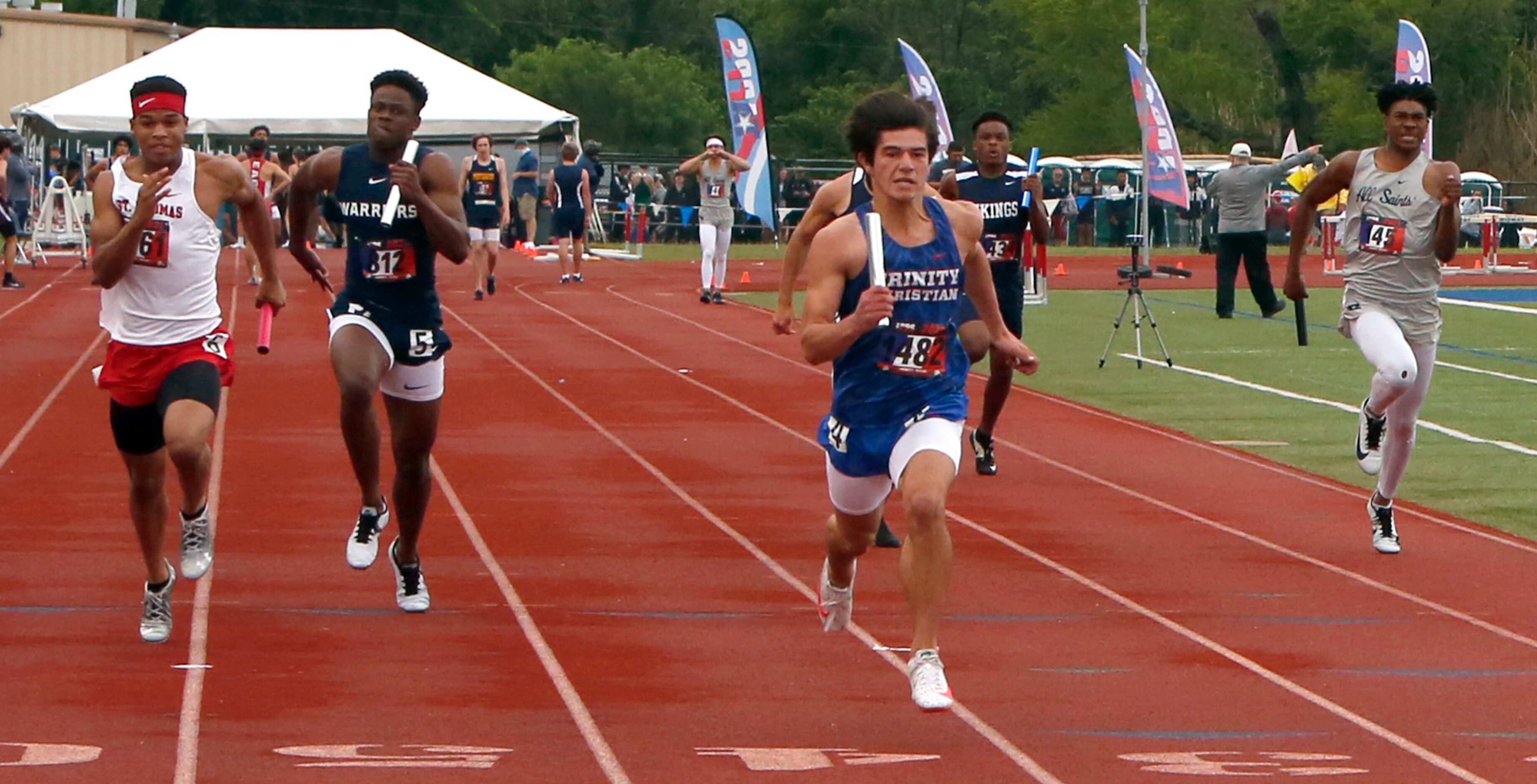 Trinity Christian Addison's Alan Morrison, center, anchors his team's first place finish in...