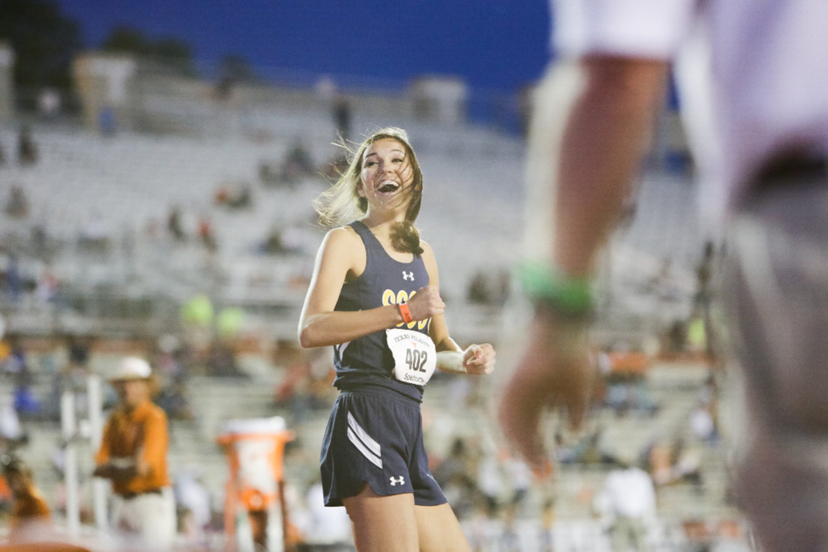 Highland Park senior Falyn Reaugh smiles after clearing the bar at a height of 6'0" during...