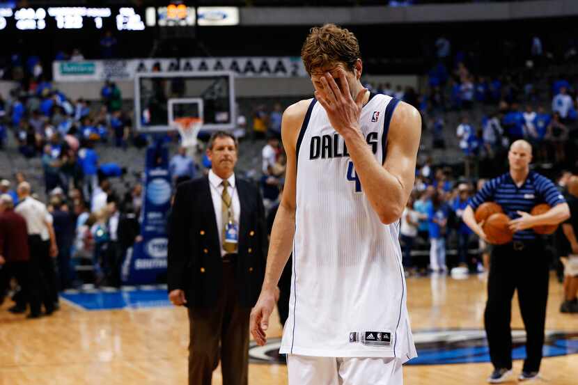 Mavericks forward Dirk Nowitzki reacts after the loss against the Golden State Warriors 