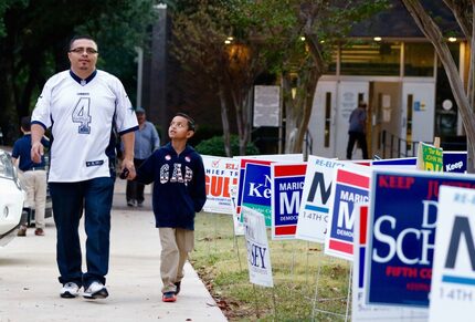 Sergio Cruz and his 8-year-old son, Nathan, walked back to their car after Nathan watched...