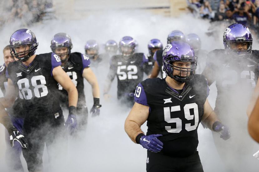 TCU Horned Frogs take the field before playing West Virginia Mountaineers at Amon G. Carter...