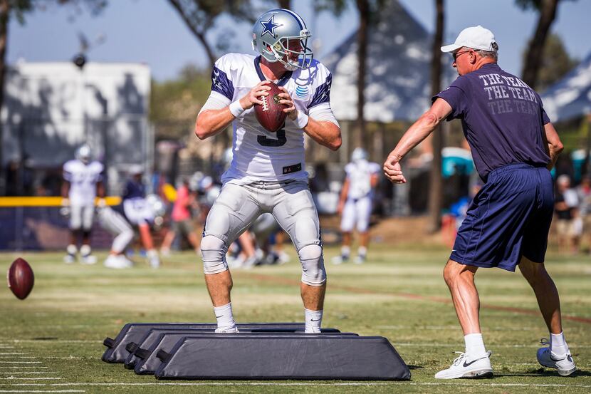 Dallas Cowboys quarterback Brandon Weeden (3) runs drills with quarterbacks coach Wade...
