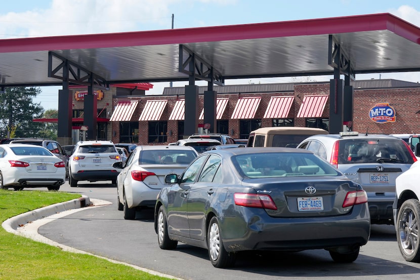 Long lines for gasoline are seen at a station Saturday, Sept. 28, 2024 in Morganton, N.C....