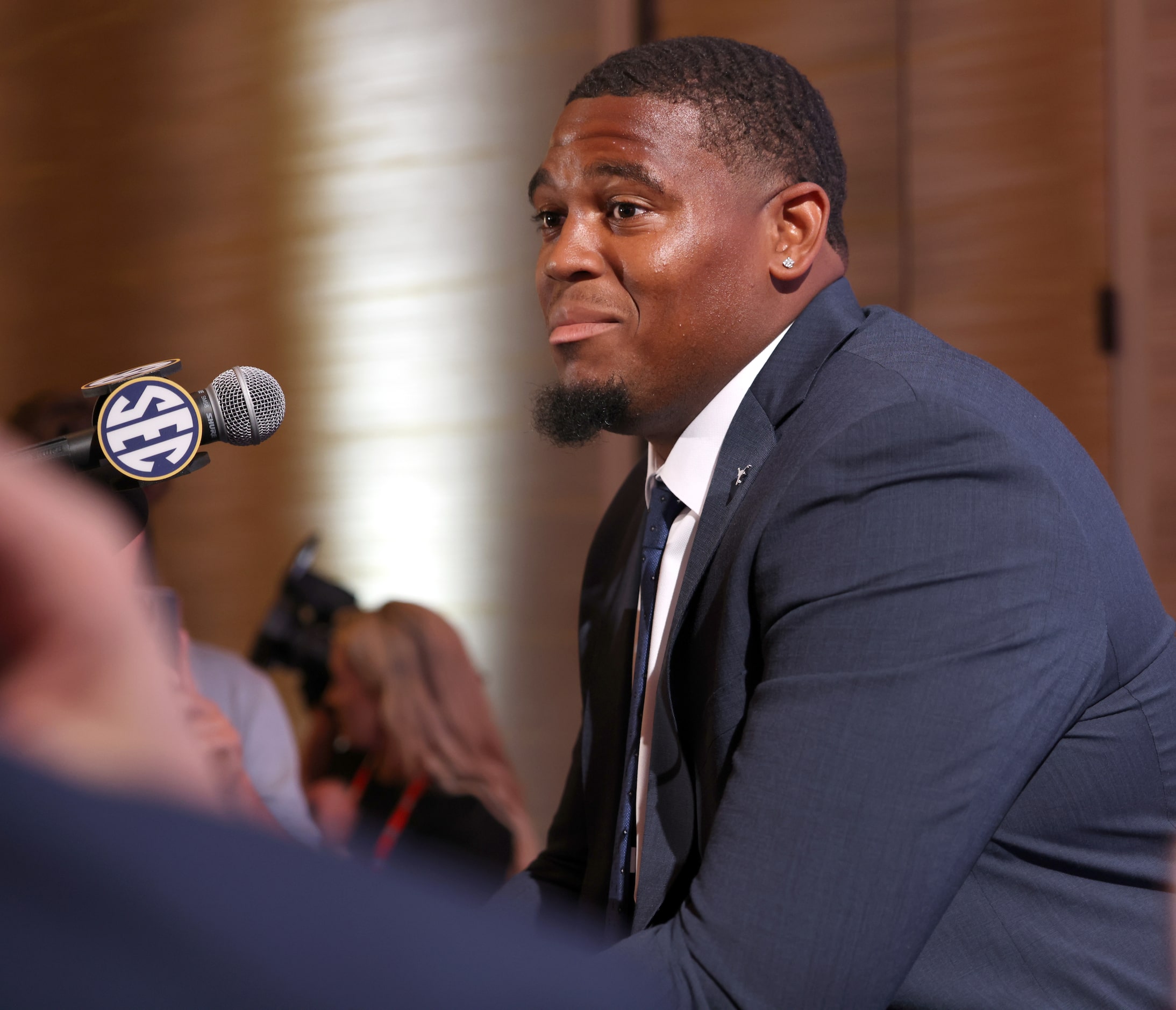 Texas Longhorns offensive tackle Kelvin Banks Jr. listens to a question from a media member...