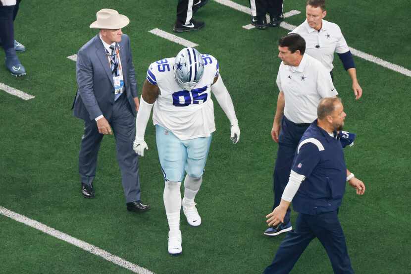Dallas Cowboys defensive tackle Johnathan Hankins (95) walks off the field after an injury...