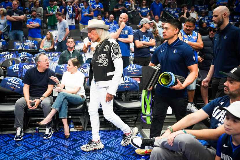 NBA super-fan Jimmy Goldstein heads to his seat before Game 4 of an NBA basketball...
