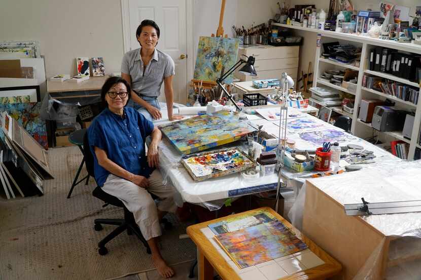 Jennifer Tsou (right) and her mother, Janet Tsou, work together in their home studio in Irving.