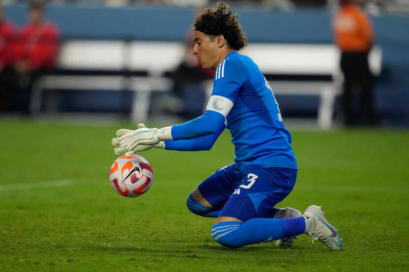 Goalkeeper Guillermo Ochoa of Mexico stops a shot by the USA by during the second half of a...