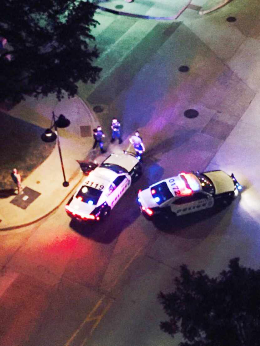 Dallas police officers responded  to gunfire directed at the police headquarters at South...